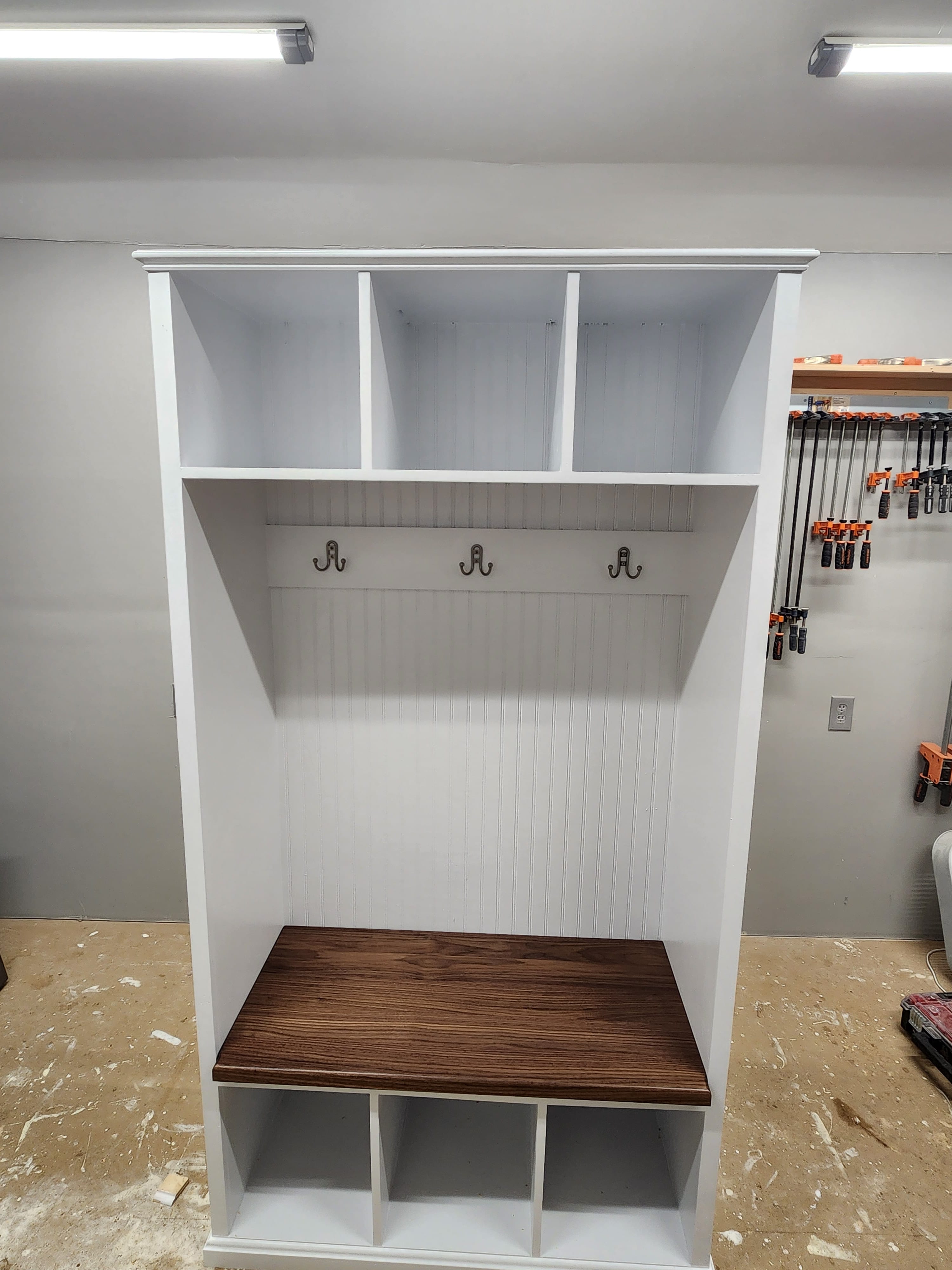 Gilmanton Hall Tree: A white cabinet with a bench and coat rack.